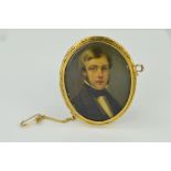 A LATE 19TH CENTURY GOLD PORTRAIT MINIATURE, of an unknown gentleman in classical attire, oval shape