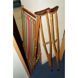TWO VINTAGE FOLDING DECK CHAIRS, and a pair of vintage crutches (4)