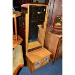 A LIGHT OAK CHEVAL MIRROR, with tiled double cupboard doors