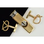 TWO ITEMS TO INCLUDE, a 9ct gold cigar cutter, engine turned, measuring approximately 52mm x 17mm,
