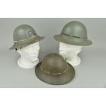 THREE ZUCKERMANN STYLE STEEL HELMETS, issued and worn by the ARP in WWII, British made, one is