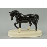 A BESWICK STOCKY JOGGING MARE, No855, 3rd version black colourway BCC gold stamp dated 2005, with