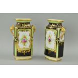 A PAIR OF NORITAKE TWIN HANDLED VASES, florally painted panels, on a white, green and black ground