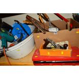 A BOX AND ENAMEL BUCKET CONTAINING A BLACK & DECKER HEDGE TRIMMER, two drills, a cable reel, saw,