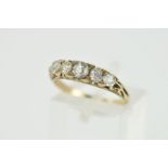 AN EARLY 20TH CENTURY DIAMOND HALF HOOP RING, five old European cut diamonds, measuring from 3.0mm-