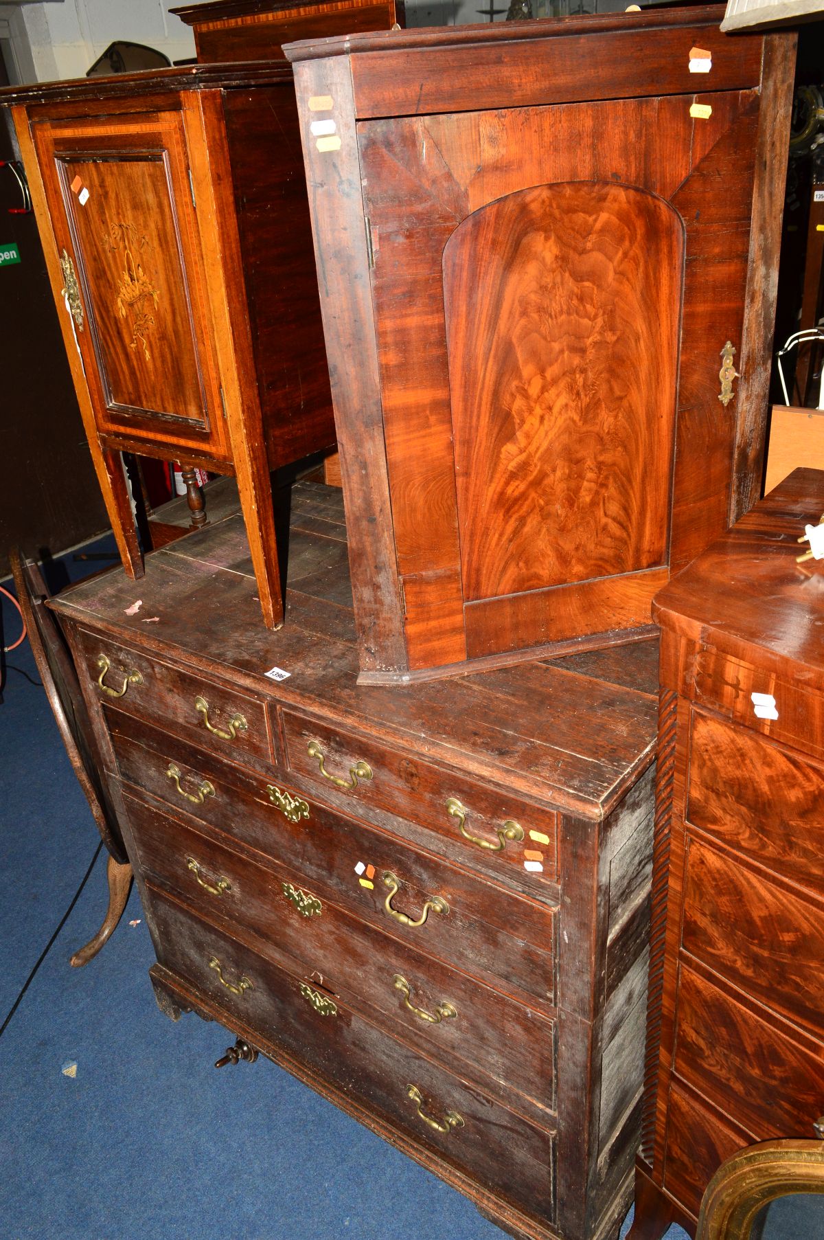 AN 18TH CENTURY AND LATER OAK CHEST OF TWO SHORT AND THREE LONG GRADUATED DRAWERS, with brass swan