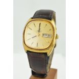 A GENTLEMANS QUARTZ OMEGA WRISTWATCH, the gold coloured face with baton markers, day and date