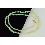 A JELLY OPAL BEAD NECKLACE, designed as graduated spherical jelly opal beads measuring 4mm to 5.5mm,