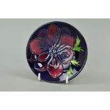 A MOORCROFT POTTERY TRINKET DISH, 'Anemone' pattern on blue ground, impressed marks to bases,