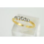 AN EARLY 20TH CENTURY FIVE STONE DIAMOND HALF HOOP RING, estimated old European cut weight 0.20ct,