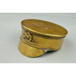 A TRENCH ART FOUR INCH SHELL CASING FORMED AS A SOLDIERS PEAKED HAT, having an applied Royal