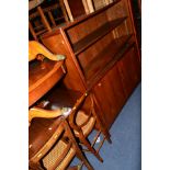 A 1970'S MAHOGANY OPEN BOOKCASE, with double cupboard doors, width 122cm x depth 35cm x height