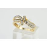 A 9CT GOLD DIAMOND DRESS RING, designed as two shaped and curved rows, channel and pave set with