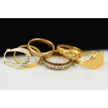 FIVE RINGS AND A SINGLE HOOP EARRING, to include a mid Victorian gold ring, two gems missing, with