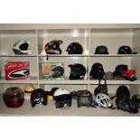 A COLLECTION OF MOTORBIKE, MOTORCROSS AND CYCLING HELMETS, along with caps, hats etc, these