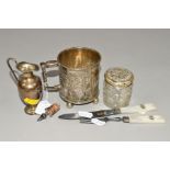 A RUSSIAN SILVER MUG, of cylindrical form, repouse decorated with a figure in a rural scene and