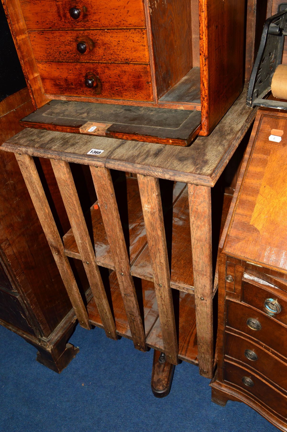 A 20TH CENTURY OAK TWO TIER REVOLVING BOOKCASE, (s.d.)