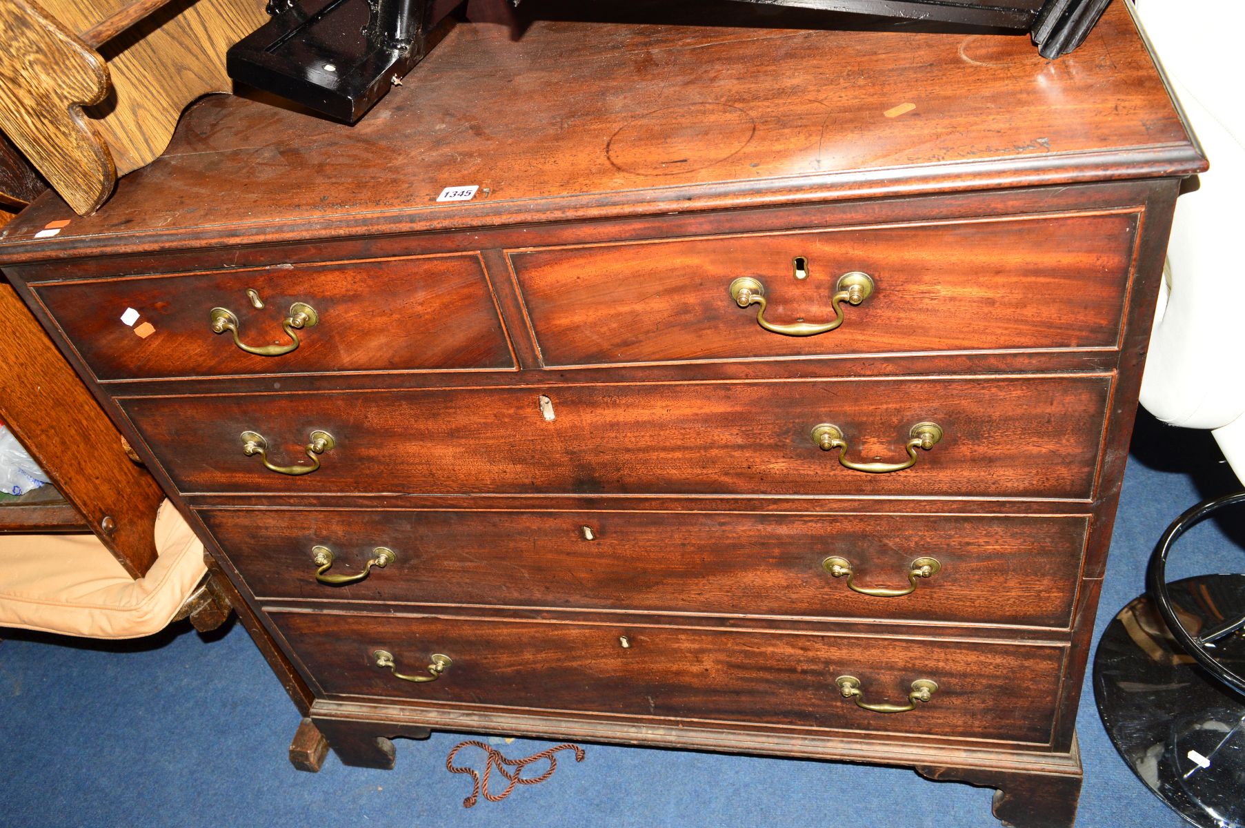 A GEORGIAN MAHOGANY CHEST OF TWO SHORT AND THREE LONG DRAWERS, with brass swan neck handles on