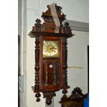 A VICTORIAN WALNUT VIENNA WALL CLOCK, (key)