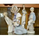 FIVE LLADRO FIGURES, 'Dog and Cat' No5032 by Juan Huerta, height 17cm, 'Boy with Yacht' No4810 by