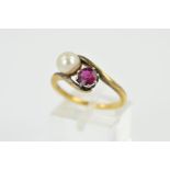 A RUBY AND CULTURED PEARL TWO STONE CROSS OVER RING, a round mixed cut ruby measuring