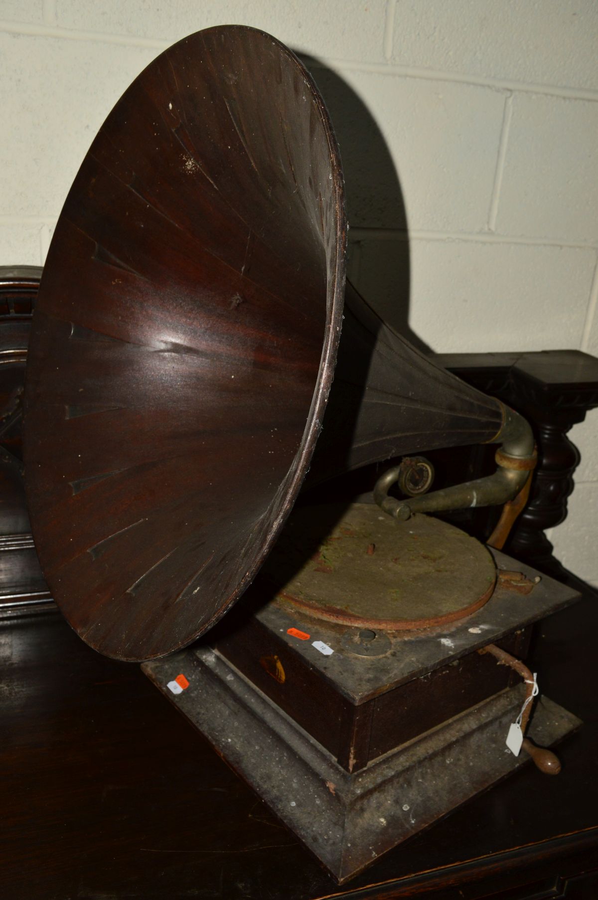 A DISTRESSED HIS MASTERS VOICE WIND-UP GRAMOPHONE, with a wooden horn