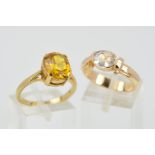 TWO 9CT GOLD GEM RINGS, the first designed as an oval synthetic yellow sapphire within a four claw
