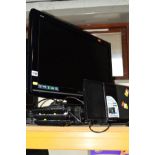 A PANASONIC 26'' FSTV, a Panasonic DVD and VHS player, together with a Panasonic sliding Iphone