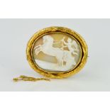 A MID VICTORIAN GOLD MEMORIAL CAMEO BROOCH, oval shell cameo depicting a winged cherub in a