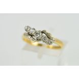 A GRADUATED FIVE STONE CROSS OVER DESIGN DIAMOND RING, estimated diamond weight 0.25ct, ring size