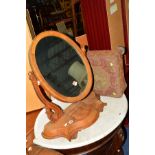 A VICTORIAN WALNUT OVAL SWING MIRROR, together with a square Georgian mahogany footstool with