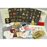A LARGE BOX CONTAINING DISPLAYS ON CARD OF BRITISH MILITARY CAP BADGES, SHOULDER TITLES, etc, WWI/