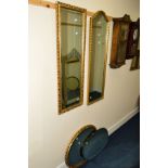 A RECTANGULAR BEVELLED EDGE WALL MIRROR, together with two similar wall mirrors and another