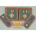 TWO SMALL GLAZED FRAMES CONTAINING A WWI GERMAN HONOUR CROSS WITH SWORDS, and a WWII 3rd Reich Merit