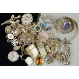 A SELECTION OF SILVER AND WHITE METAL JEWELLERY, to include an enamel flower brooch, an ingot