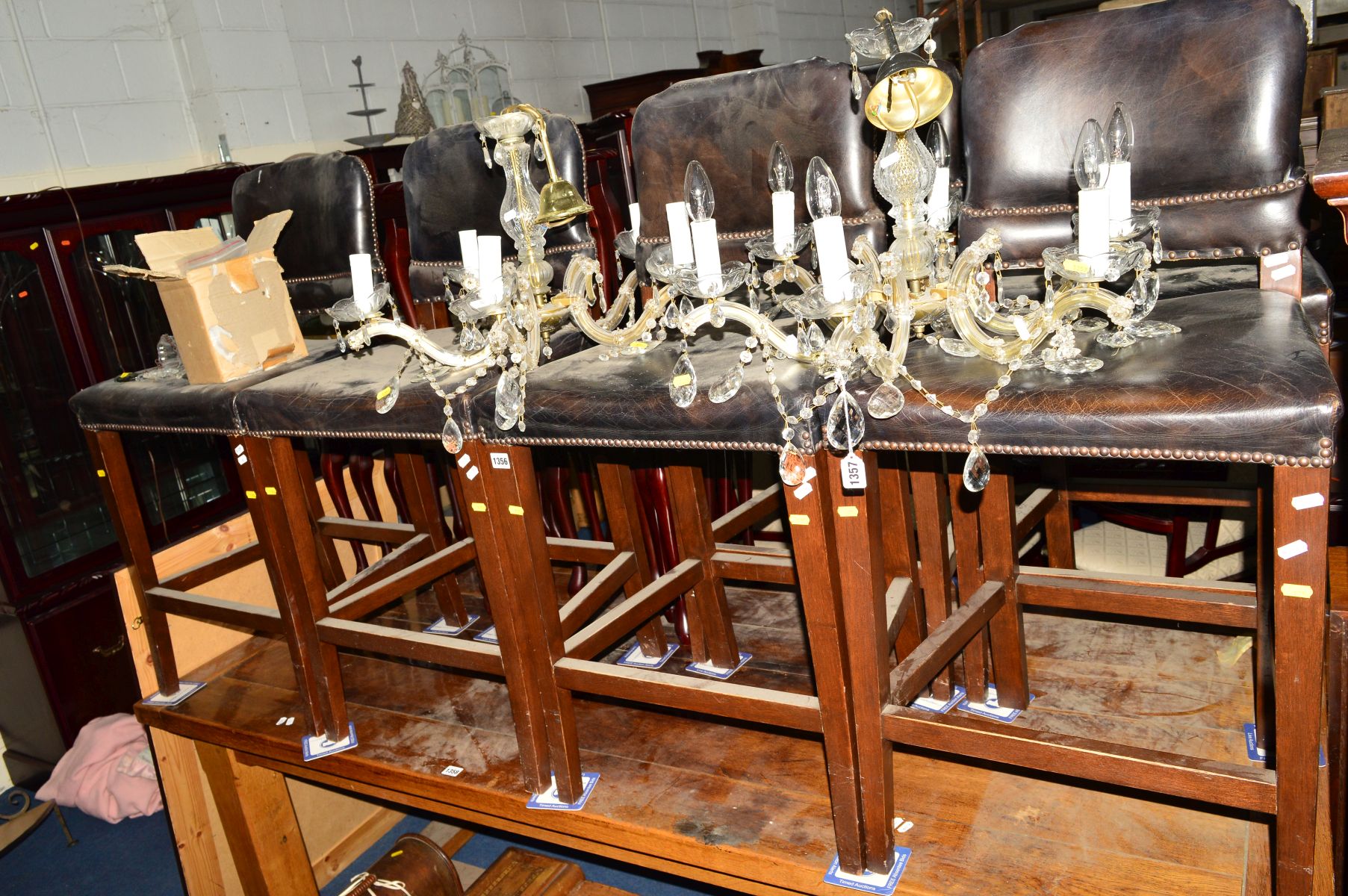 A SET OF SIX BLACK LEATHER BUTTONED BAR STOOLS, on oak frames (6)