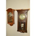 AN EARLY 20TH CENTURY OAK WALL CLOCK, together with another oak wall clock (2)