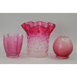 THREE CRANBERRY COLOURED GLASS SHADES, largest height 22cm (3)