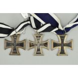 THREE EXAMPLES OF GERMAN IMPERIAL FORCES WWII ERA IRON CROSSES, one is marked with a lion on the
