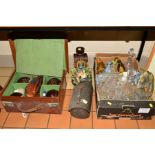 A LEATHER CASE CONTAINING FOUR LAWN BOWLS, Hemselite, size 6, measuring device, chalk, shoes, cloths