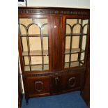 AN EDWARDIAN MAHOGANY BOWFRONT ASTRAGAL GLAZED TWO DOOR DISPLAY CABINET, two internal shelves