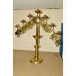 A VICTORIAN BRASS GOTHIC ECCLESIASTICAL SEVEN LIGHT CANDELABRUM, with ratchet fittings to both