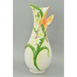 A GRAFF PORCELAIN VASE, decorated with raised butterfly flowers and foliage, height 41cm
