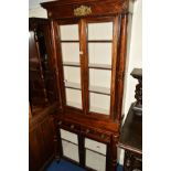 A VICTORIAN AND LATER SIMULATED ROSEWOOD AND MAHOGANY FOUR DOOR GLAZED BOOKCASE, with brass moulding