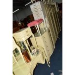 A CREAM AND GILT SEVEN PIECE BEDROOM SUITE, comprising of two sized double door wardrobes, maximum
