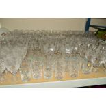 A LARGE QUANTITY OF CUT GLASS DRINKING GLASSES, to include red and white wine, port, sherry,
