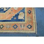 A TALISH RUG, red and blue ground with geometric detail, approximately 277cm x 199cm (condition: