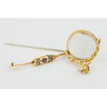 A 9CT GOLD EDWARDIAN GEM BROOCH AND A LATE VICTORIAN 15CT GOLD SWIVEL FOB, the bar brooch set with a