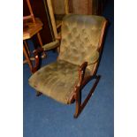 A REPRODUCTION MAHOGANY GREEN BUTTONED ROCKING CHAIR, (s.d.)