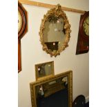 A MODERN FOLIATE GILT FRAMED WALL MIRROR, together with two other wall mirrors (3)